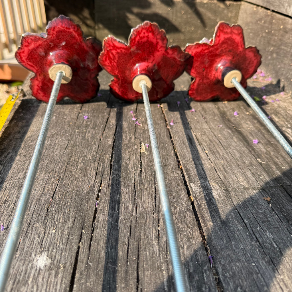 Red poppy garden ceramic flowers on tall metal stems