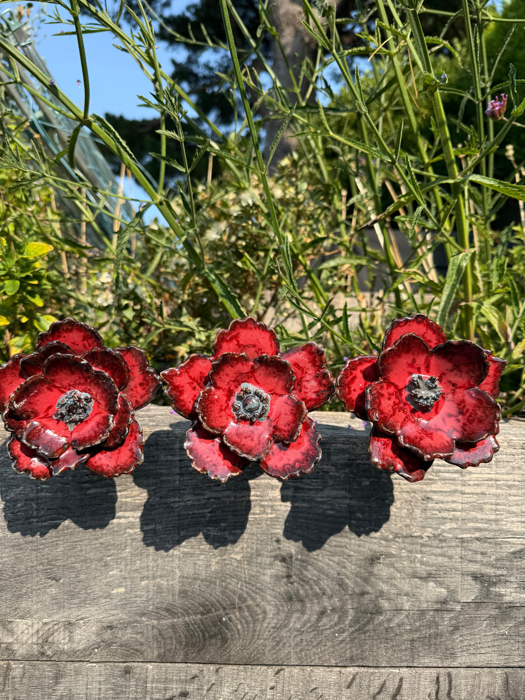 Red poppy garden ceramic flowers on tall metal stems