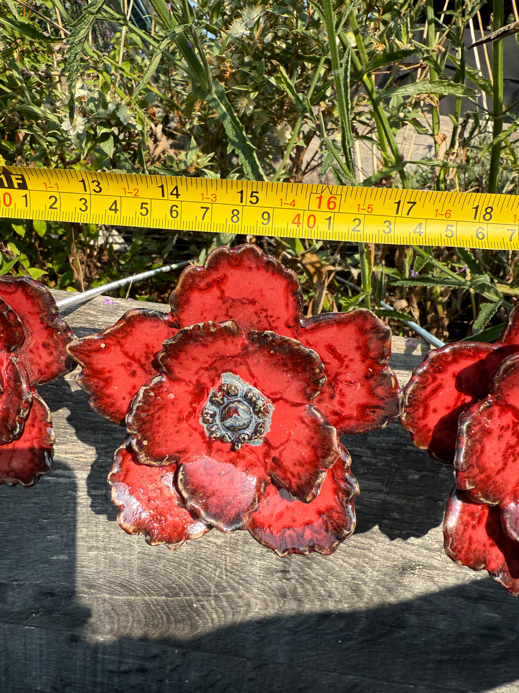 Red poppy garden ceramic flowers on tall metal stems
