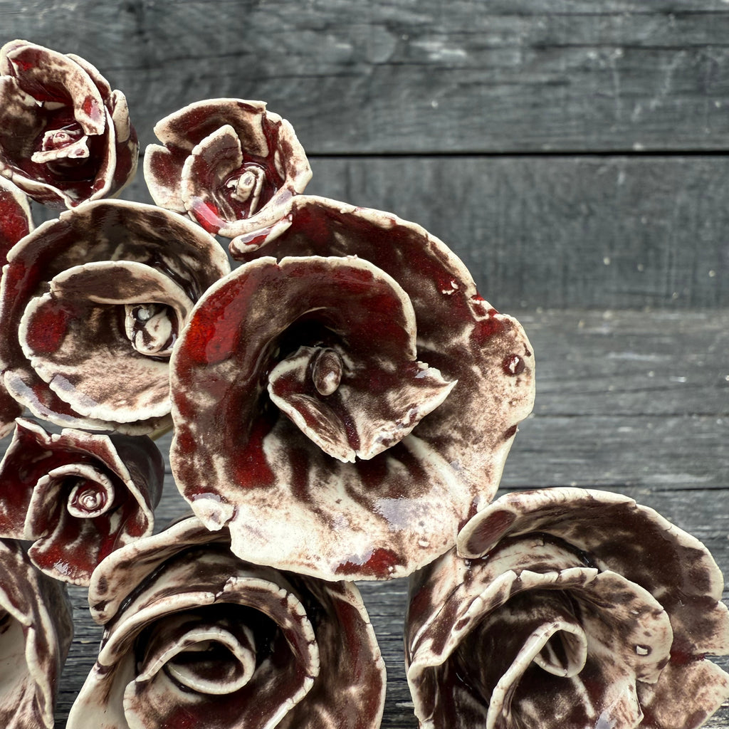 A whole bouquet of 21 rustic reds ceramic roses - each on metal stem