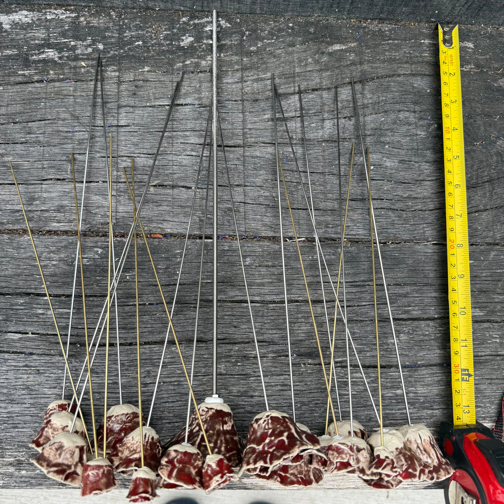 A whole bouquet of 21 rustic reds ceramic roses - each on metal stem