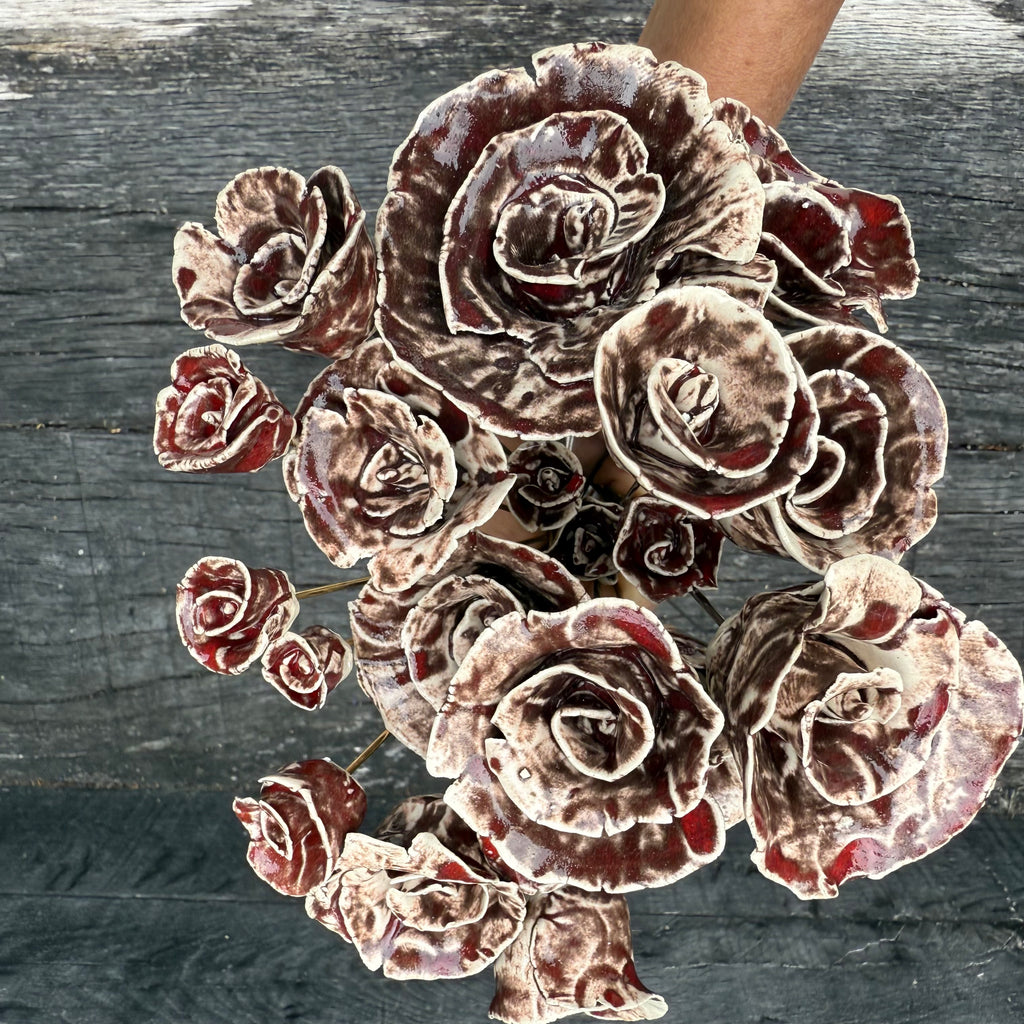 A whole bouquet of 21 rustic reds ceramic roses - each on metal stem