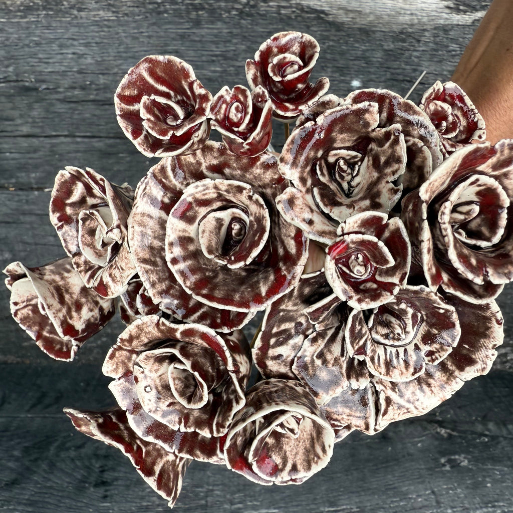 A whole bouquet of 21 rustic reds ceramic roses - each on metal stem