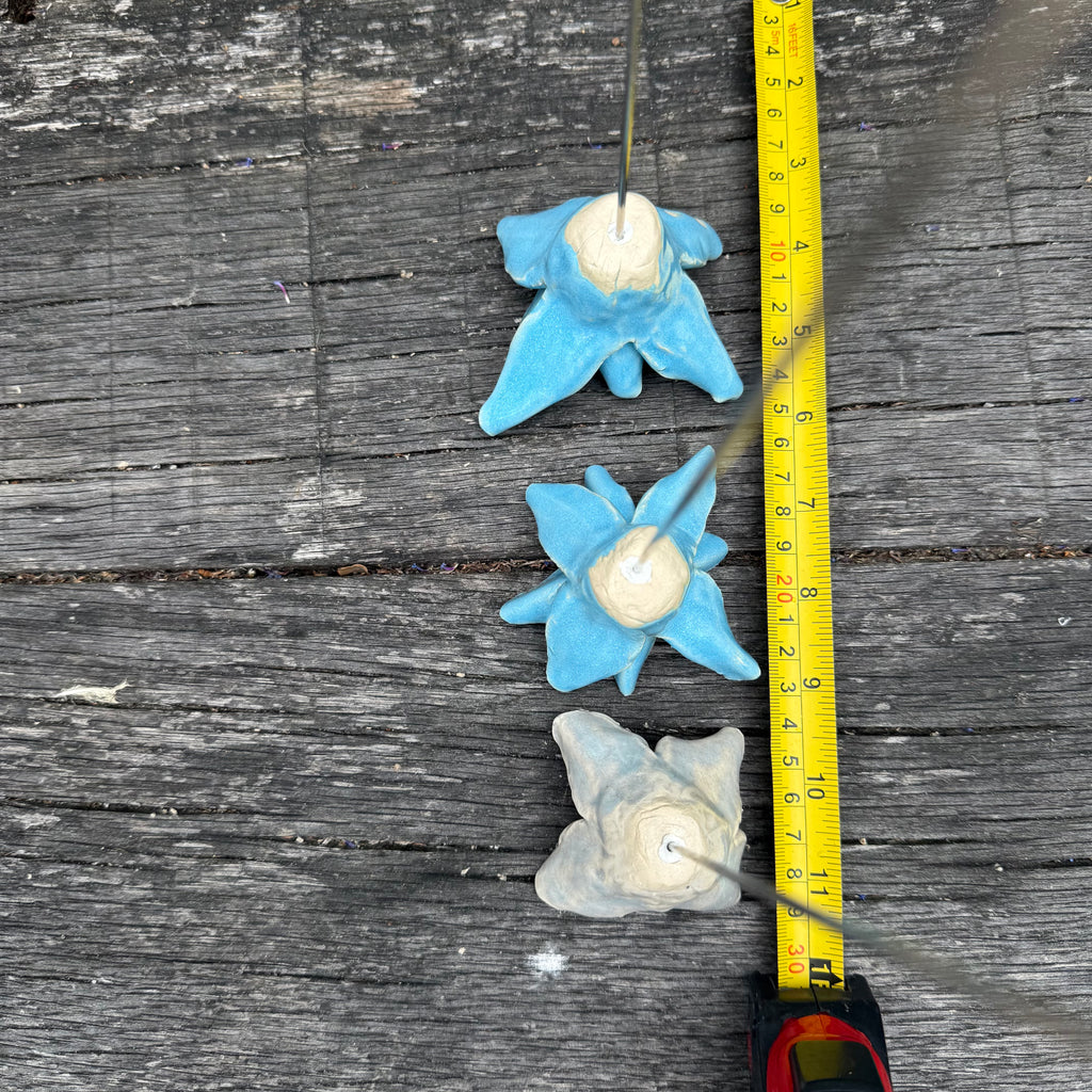 Handmade set of 3 ceramic blue flowers (each on a metal stem)