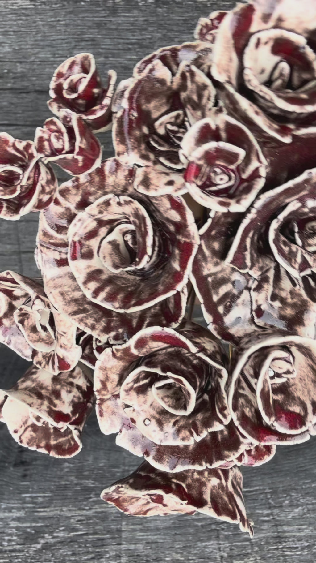 A whole bouquet of 21 rustic reds ceramic roses - each on metal stem